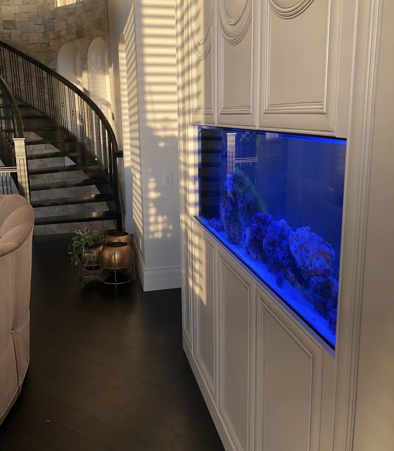 Custom built-in aquarium with cabinetry in Calgary home